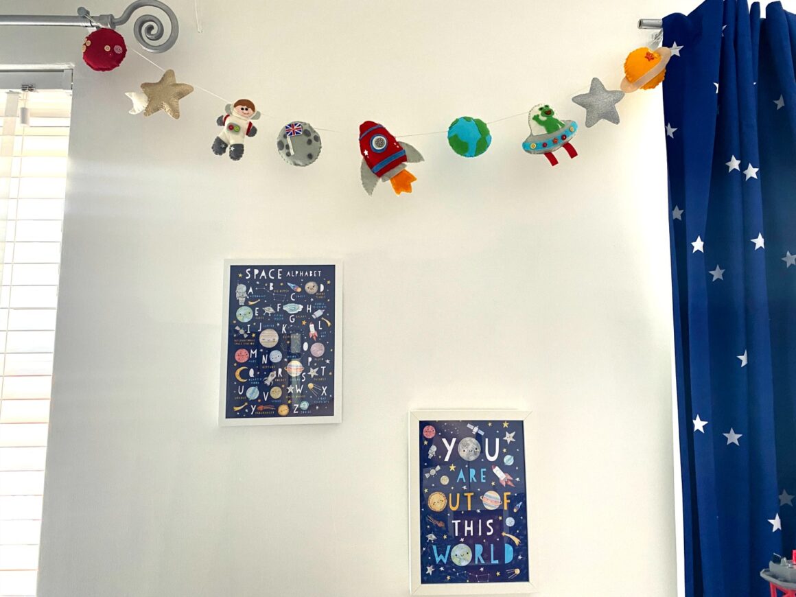 handmade bunting and picture frames on wall