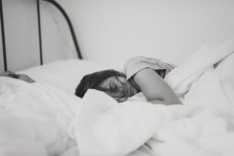 Female asleep in bed